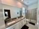 Double vanity bathroom with a large walk-in shower at 8900 Takeaway Way, Davenport, FL 33896