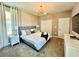 Spacious bedroom with a king-size bed and ensuite bathroom at 8900 Takeaway Way, Davenport, FL 33896