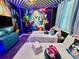 Alice in Wonderland bedroom with two beds and whimsical decor at 8900 Takeaway Way, Davenport, FL 33896