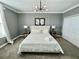 King bed, neutral color palette, and ample natural light at 8900 Takeaway Way, Davenport, FL 33896