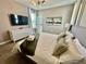 Main bedroom with king bed, neutral decor and large TV at 8900 Takeaway Way, Davenport, FL 33896