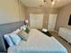 Bright bedroom with a king-size bed and neutral color palette at 8900 Takeaway Way, Davenport, FL 33896
