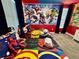 Superhero themed bedroom with twin beds and mural at 8900 Takeaway Way, Davenport, FL 33896