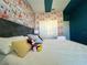 Mickey Mouse themed bedroom with king-size bed and closet at 8900 Takeaway Way, Davenport, FL 33896