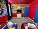Superhero themed bedroom with twin beds and mural at 8900 Takeaway Way, Davenport, FL 33896