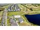 Aerial view of community center with nearby lake and homes at 8900 Takeaway Way, Davenport, FL 33896