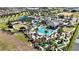 Aerial view of community pool area, water park, and clubhouse at 8900 Takeaway Way, Davenport, FL 33896