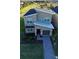 Contemporary two-story house with gray siding and a brick facade at 8900 Takeaway Way, Davenport, FL 33896