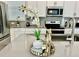 Kitchen island detail showcasing modern decor and finishes at 8900 Takeaway Way, Davenport, FL 33896