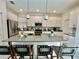 Modern kitchen with white cabinets and a large island at 8900 Takeaway Way, Davenport, FL 33896