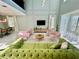Open living space with high ceilings and a large TV at 8900 Takeaway Way, Davenport, FL 33896