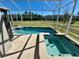 Screened pool and spa with backyard view at 8900 Takeaway Way, Davenport, FL 33896