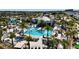 Aerial view of resort-style pool with a large deck, palm trees, and lounge chairs at 8900 Takeaway Way, Davenport, FL 33896