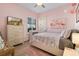 Charming bedroom with flamingo decor and hardwood floors at 9918 Santa Barbara Ct, Howey In The Hills, FL 34737