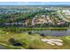 Aerial view of community near golf course and lake at 1021 Siena Park E Blvd # 103, Kissimmee, FL 34747