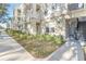 Building exterior with walkway and landscaping at 1021 Siena Park E Blvd # 103, Kissimmee, FL 34747