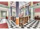 Community bar with seating and a checkerboard floor at 1021 Siena Park E Blvd # 103, Kissimmee, FL 34747