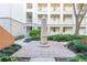 Courtyard with brick pavement and a tall obelisk at 1021 Siena Park E Blvd # 103, Kissimmee, FL 34747