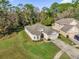 Single-story home with a driveway and a large backyard at 11350 Cypress Trail Dr, Orlando, FL 32825