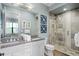 Bathroom with granite countertop and walk-in shower at 1261 Radiant St, Reunion, FL 34747