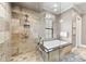 Spa-like bathroom with a large walk-in shower and soaking tub at 1261 Radiant St, Reunion, FL 34747