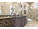 Elegant bathroom with double vanity, granite countertop, and a large glass shower at 1261 Radiant St, Reunion, FL 34747