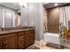 Double vanity, bathtub, and modern tile at 1261 Radiant St, Reunion, FL 34747