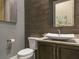 Modern bathroom with floating vanity and unique vessel sink at 1261 Radiant St, Reunion, FL 34747