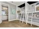 Bedroom with bunk beds, adjacent bathroom access at 1261 Radiant St, Reunion, FL 34747