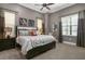 Modern bedroom with king bed, gray walls, and patterned bedding at 1261 Radiant St, Reunion, FL 34747
