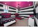 Bedroom with two beds and black and white striped walls at 1261 Radiant St, Reunion, FL 34747