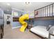 Playful bedroom with a yellow slide and a bunk bed at 1261 Radiant St, Reunion, FL 34747