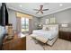 King-size bed, stylish decor, and plenty of natural light at 1261 Radiant St, Reunion, FL 34747