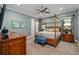 Charming bedroom with a canopy bed and a view to the outside at 1261 Radiant St, Reunion, FL 34747