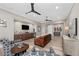 Relaxing common area with leather couches, a large TV, and a wet bar at 1261 Radiant St, Reunion, FL 34747