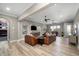 Spacious common area with leather seating, a large TV and a wet bar at 1261 Radiant St, Reunion, FL 34747
