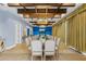 Formal dining room with long table and large windows at 1261 Radiant St, Reunion, FL 34747