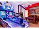 Fun game room with bowling game, arcade games, and a pool table at 1261 Radiant St, Reunion, FL 34747