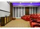 Elegant home theater featuring plush seating and a large screen for movie nights at 1261 Radiant St, Reunion, FL 34747