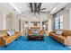 Living room with comfortable seating and view into kitchen at 1261 Radiant St, Reunion, FL 34747
