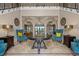 Spacious living room with seating area and large windows at 1261 Radiant St, Reunion, FL 34747