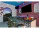 Outdoor bar with seating and wine decor at 1261 Radiant St, Reunion, FL 34747