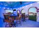 Outdoor bar with seating and painted ceiling at 1261 Radiant St, Reunion, FL 34747