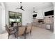 Outdoor kitchen with dining area and built-in appliances at 1261 Radiant St, Reunion, FL 34747