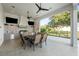 Outdoor kitchen with grill, bar seating, and ample counter space at 1261 Radiant St, Reunion, FL 34747