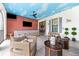 Outdoor lounge with wicker furniture and bar at 1261 Radiant St, Reunion, FL 34747