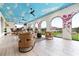 Outdoor lounge with wicker furniture and view at 1261 Radiant St, Reunion, FL 34747