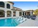 Resort-style pool with in-pool loungers and patio furniture at 1261 Radiant St, Reunion, FL 34747