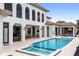 Luxury pool and spa with outdoor kitchen and lounge area at 1261 Radiant St, Reunion, FL 34747