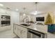 Spacious kitchen island with sink and dishwasher, white cabinets at 13820 Orchard Leaf Way, Winter Garden, FL 34787